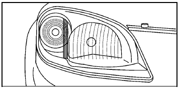 To adjust the vertical aim on the headlamps: