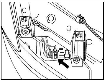 6. Locate the vertical headlamp aiming screws, which